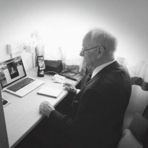 Black & white photo of Dr Terence Palmer PhD in his office
