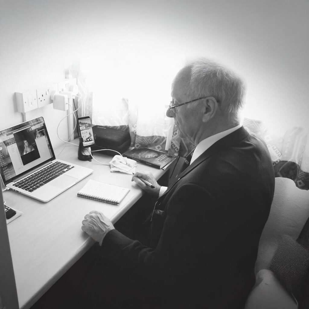 Black & white photo of Dr Terence Palmer PhD in his office