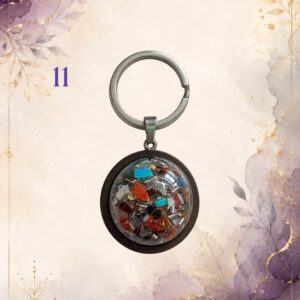 Wonky Wuns handmade orgonite keyring with a wooden surround, piece number 11, set with mixed crystal chips
