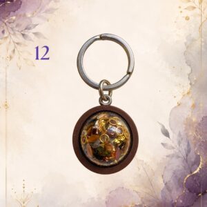 Wonky Wuns handmade orgonite keyring with a wooden surround, piece number 12, set with mixed crystal chips