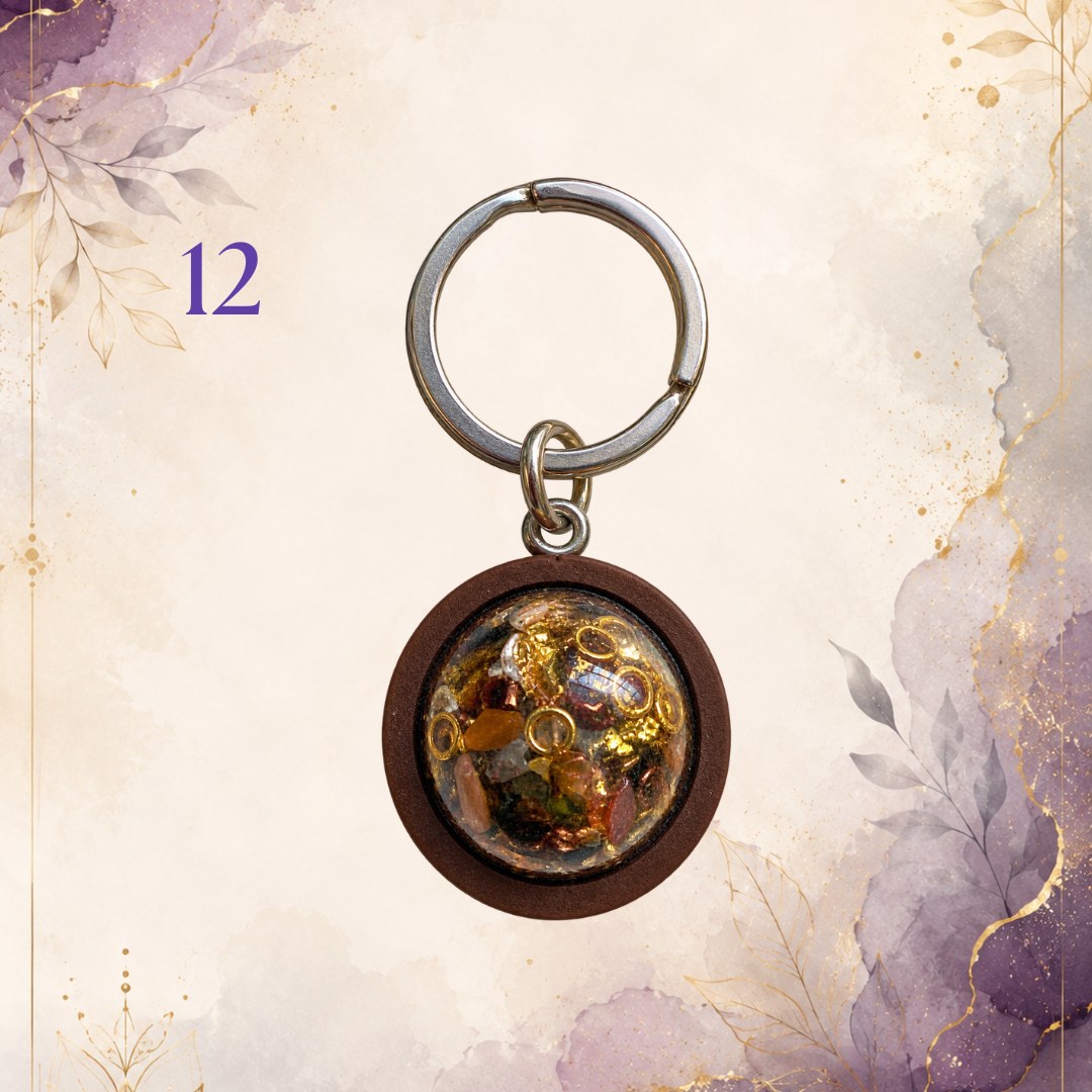Wonky Wuns handmade orgonite keyring with a wooden surround, piece number 12, set with mixed crystal chips