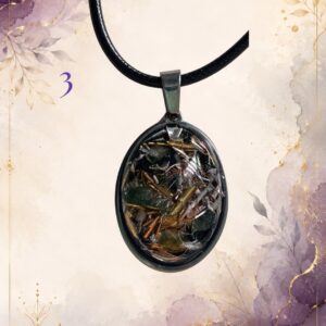 Wonky Wuns handmade orgonite pendant on a black cord, piece number 3, set with mixed crystal chips
