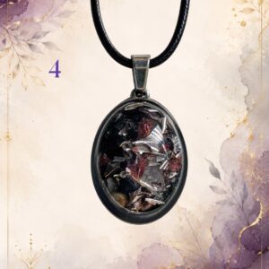 Wonky Wuns handmade orgonite pendant on a black cord, piece number 4, set with mixed crystal chips