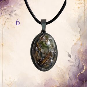Wonky Wuns handmade orgonite pendant on a black cord, piece number 6, set with mixed crystal chips