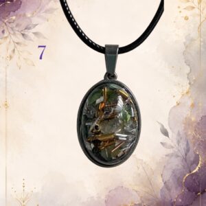 Wonky Wuns handmade orgonite pendant on a black cord, piece number 7, set with mixed crystal chips