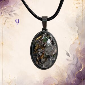 Wonky Wuns handmade orgonite pendant on a black cord, piece number 9, set with mixed crystal chips